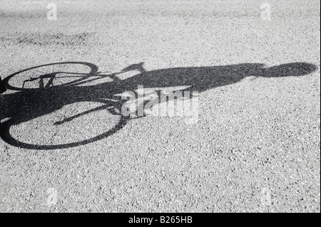 Shadow of a bicyclist casting on road