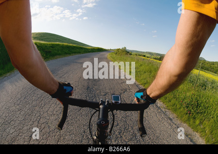 Close-up view of hands on handle bars of a bicycle Stock Photo