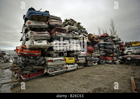 Car breakers yard New Zealand Mainly Japanese cars stacked high after processing and awaiting the crusher Stock Photo