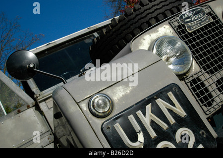 Close up onto the front of a grey 1950's Land Rover Series One 86 inch Station Wagon. Stock Photo