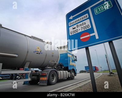 Trucks at the Dutch Belgian border in Hazeldonk along the E19 highway import export international trade Stock Photo