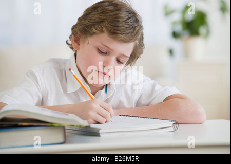 Boy doing homework Stock Photo