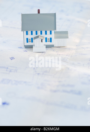 Model house on blueprints Stock Photo