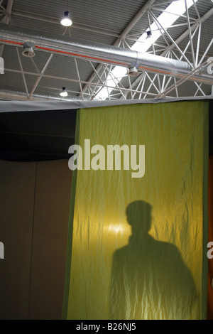 silhouette male model mannequin behind curtains Stock Photo