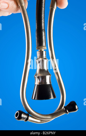 Closeup of a hand holding a doctor s stethoscope Stock Photo