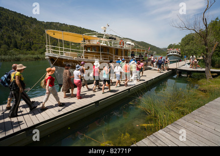 Krka waterfalls, Skradinski buk area, Croatia, Europe, visitors leaving via boat transport Stock Photo