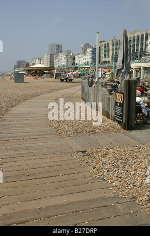 City of Brighton and Hove, England. Board walkway to one of the many pubs, clubs, bars, cafes and restaurants on Brighton beach. Stock Photo