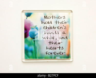 a small sign with a trusim about motherly love Stock Photo