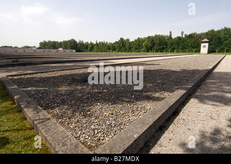 Watch tower and site of the former barracks at the Dachau concentration camp on the outskirts of Munich in Germany. Stock Photo