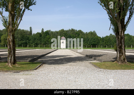 Watch tower and site of the former barracks at the Dachau concentration camp on the outskirts of Munich in Germany. Stock Photo