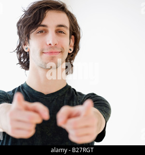 Portrait of man pointing fingers Stock Photo