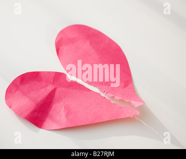 Paper heart ripped in half Stock Photo