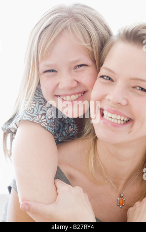 Mother and daughter hugging Stock Photo