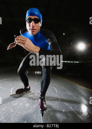 Male speed skater on ice Stock Photo