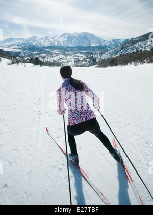 Woman cross country skiing Stock Photo