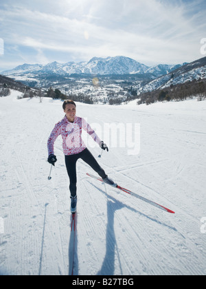 Woman cross country skiing Stock Photo