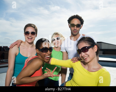 Multi-ethnic friends wearing sunglasses Stock Photo