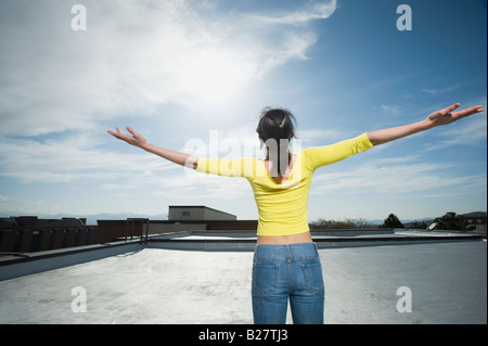 Woman with arm outstretched Stock Photo
