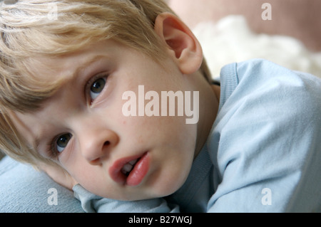 A young boy watching television Stock Photo