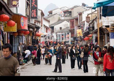 Crowded shopping street in Yangshuo China Stock Photo