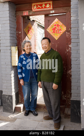 Mr and Mrs Wu outside their home in the Hutongs area Beijing China Stock Photo