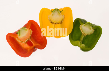 Halved yellow  red green  bell pepper capsicum annum Stock Photo