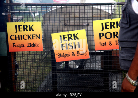 Jerk chicken, fish and pork signs at London festival Stock Photo