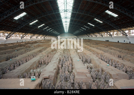 Tourists view infantry figures from the edge of Pit 1 at Qin Museum exhibition halls of Terracotta Warriors China Stock Photo