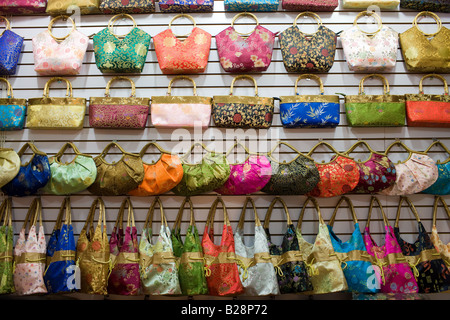 Handbags for sale at market stall in Moslem district of Xian China Stock Photo