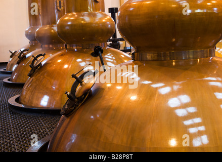 The Glenmorangie distillery branding on the orange wall of the visitor  centre in Tain Stock Photo - Alamy