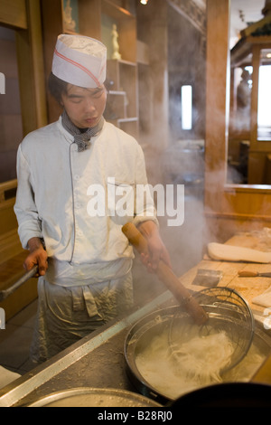 Chef cooking noodles in typical tourist restaurant Xian China Stock Photo