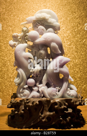 Lavender jade dolphins ornament on display in the Huahui Jade Factory and Showroom Xian China Stock Photo