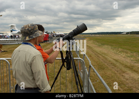 Pro photographer taking a photograph Farnborough Air Show 2008 Stock Photo