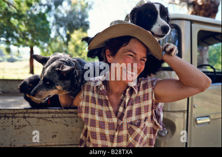 Farmer and her dogs Australia Stock Photo