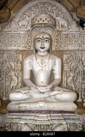 A hand carved WHITE MARBLE statue of MAHAVIRA in the CHANDRAPRABHU JAIN TEMPLE inside JAISALMER FORT RAJASTHAN INDIA Stock Photo