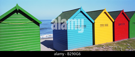 Row Of Colourful Beach Huts At Whitby England Stock Photo