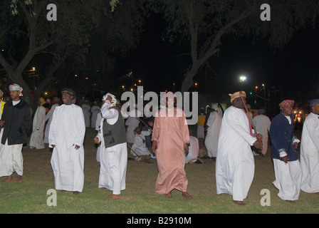 Omani men perform a circle dance at the Muscat Festival Stock Photo