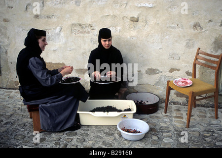 Nuns at the painted monasteries Bucovina Romania Stock Photo