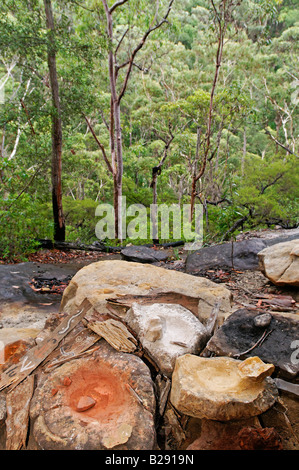 Natural paint in mortars of Aborigines, Blue Mountains, New South Wales, Australia Stock Photo
