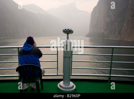 Tourist takes photographs from the deck of Victoria Line Cruise Ship Yangtze River China Stock Photo