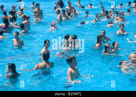 Israel Sfaim water Park summer fun in a crowded swimming pool Stock Photo