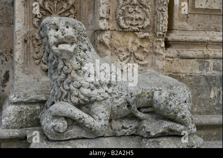 Stone lion in front of St Sebastian Church Stock Photo