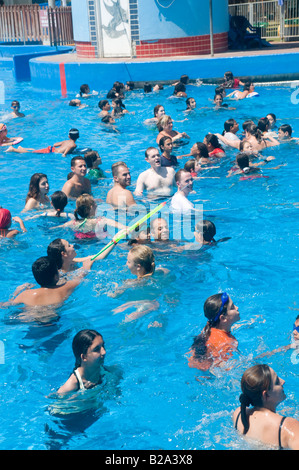 Israel Sfaim water Park summer fun in a crowded swimming pool Stock Photo