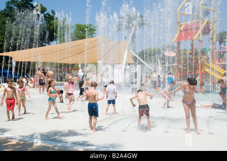 Israel Sfaim water Park summer fun children playing in water jets Stock Photo