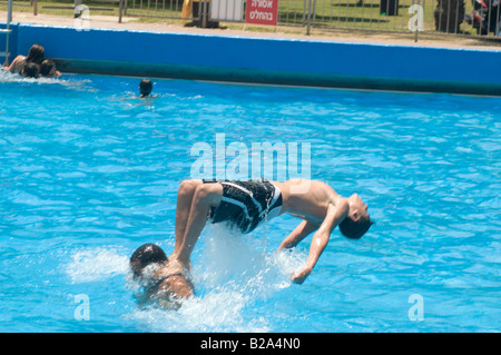 Israel Sfaim water Park summer fun somersault in a pool Stock Photo