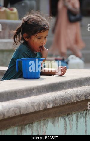 Nepalese little girl in streets of Kathmandu Stock Photo