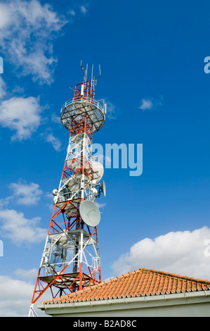 Radio communications station and tower with various types of antennas Stock Photo