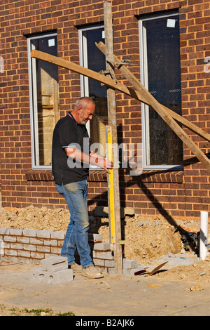 Professions / A Bricklayer at work on a building site.Melbourne Victoria Australia. Stock Photo