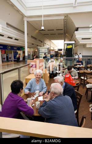 UK Tyne and Wear Sunderland Bridges Shopping Centre shoppers relaxing in cafe Stock Photo