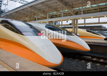 Three Shinkansen 700T high speed rail trains Zouying Kaohsiung station Taiwan ROC Stock Photo